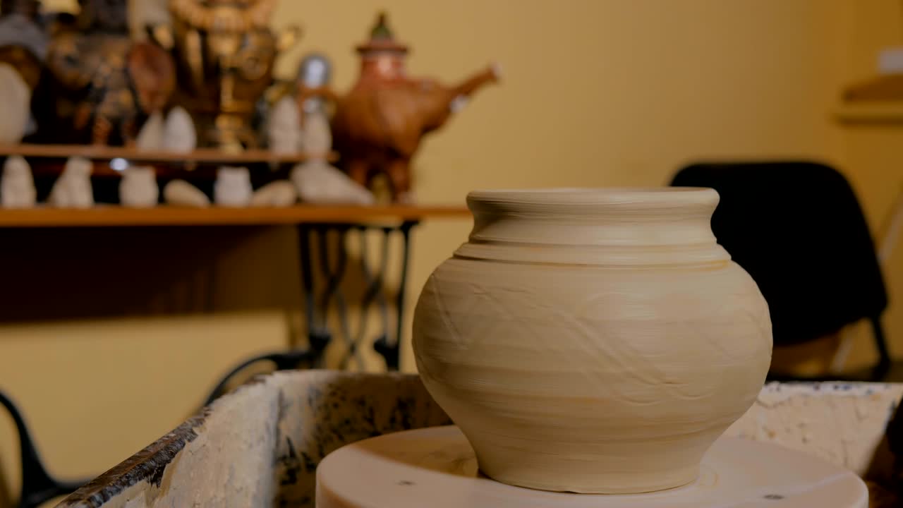 Ceramic pot on pottery wheel