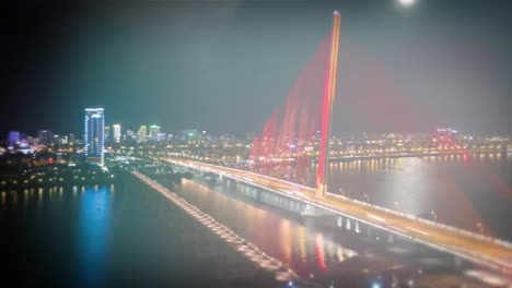 night cityscape with bridge and waterfall