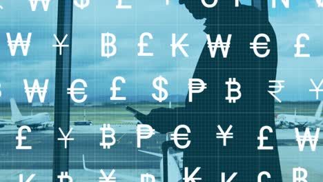 animation of currency symbols over caucasian businessman at airport