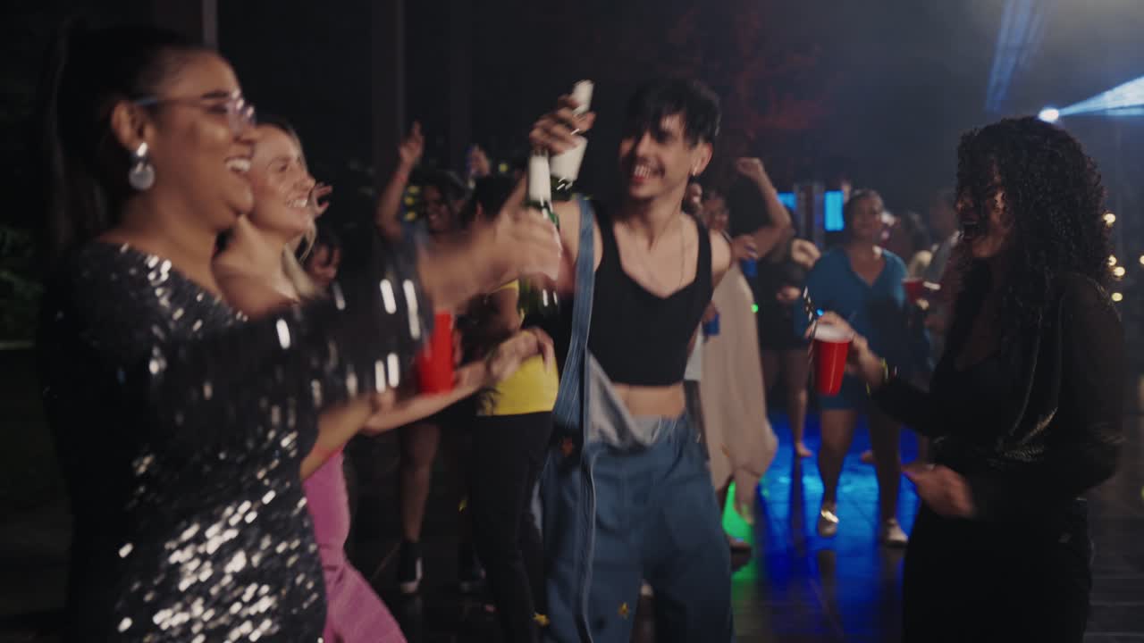 Diverse Group of Friends Dancing and Socializing at a Lively Night Party