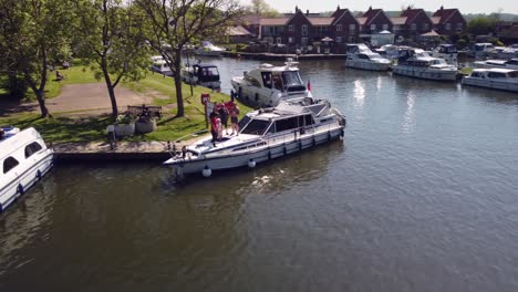 Aerial-Drone-Footage-Circling-a-Boat-Moored-at-Beccles-Marina,-Norfolk