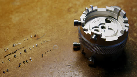 close-up of clock repairing tool and screws