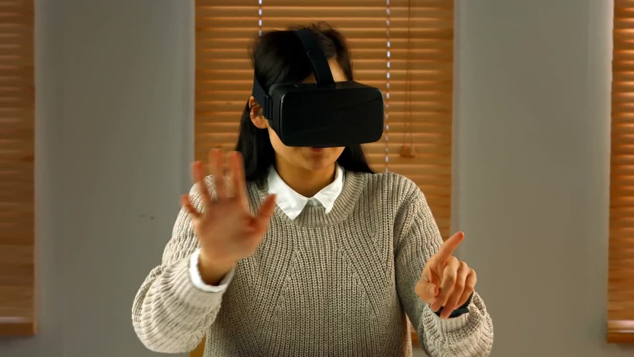 Female business executive using virtual glasses