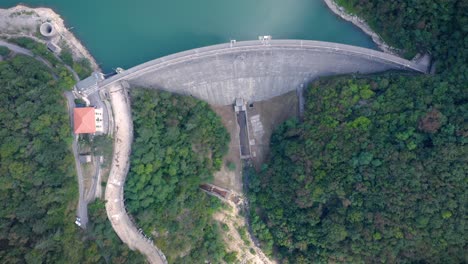 top down drone shot reveal an artificial lake near genova, liguria, italy