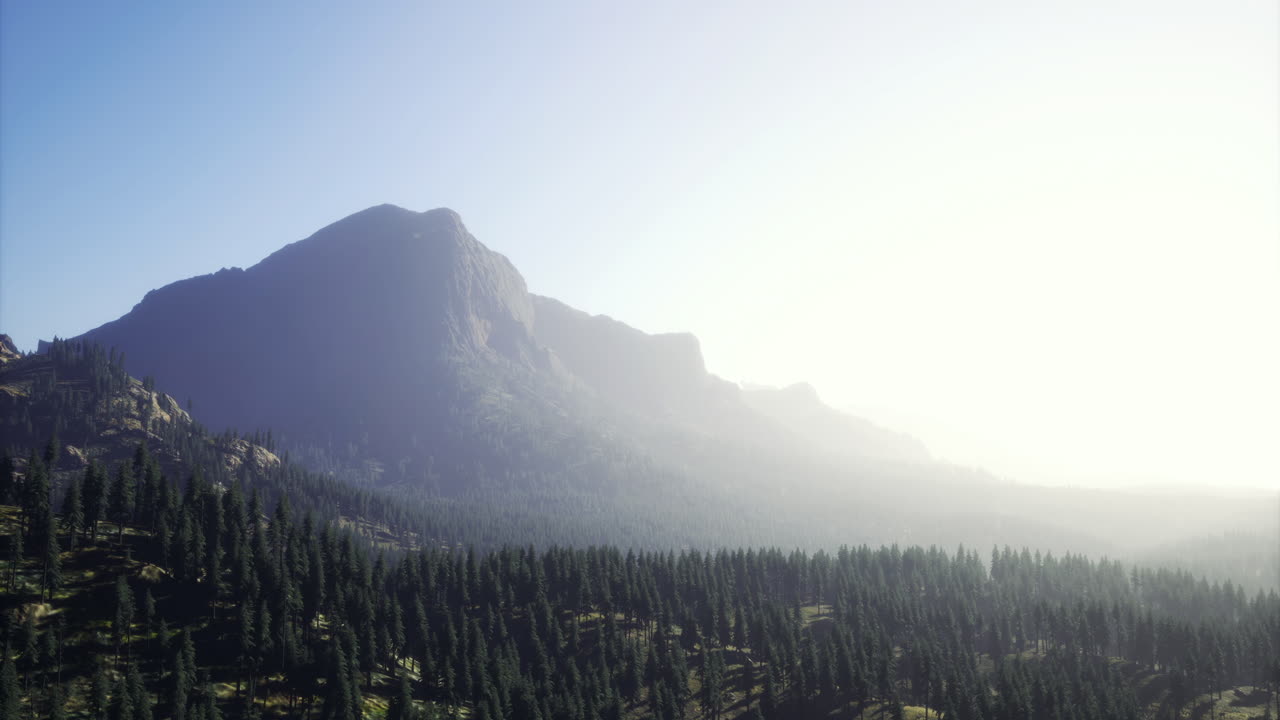 Majestic mountain range under a soft morning light in a serene landscape