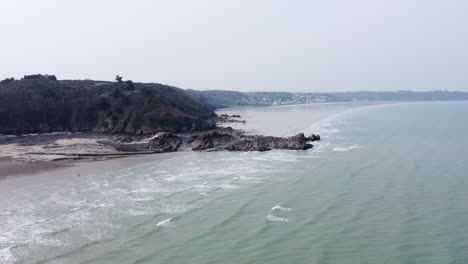 rugged coastline in brittany, france, aerial pullback