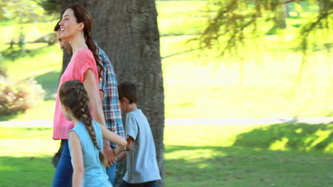 happy family walking in the park