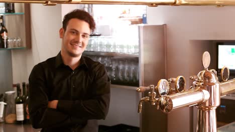 bar tender standing at bar counter