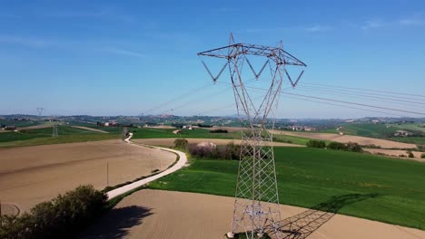 aerial view of electric infrastructure for electricity transportation with cables and trellis in a rural landscape