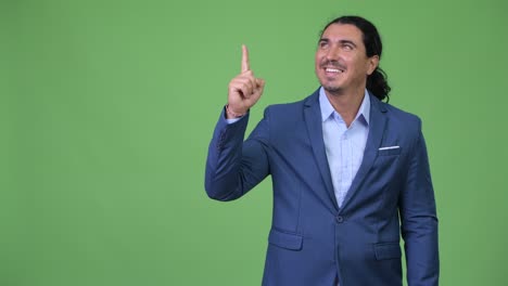 handsome businessman pointing finger up