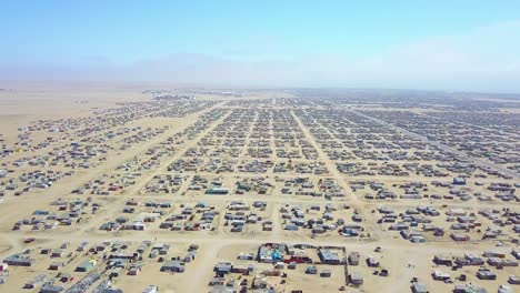 Aerial-over-a-strange-abandoned-town-of-empty-lonely-suburban-tract-houses-in-the-desert-of-Namibia-Africa-3