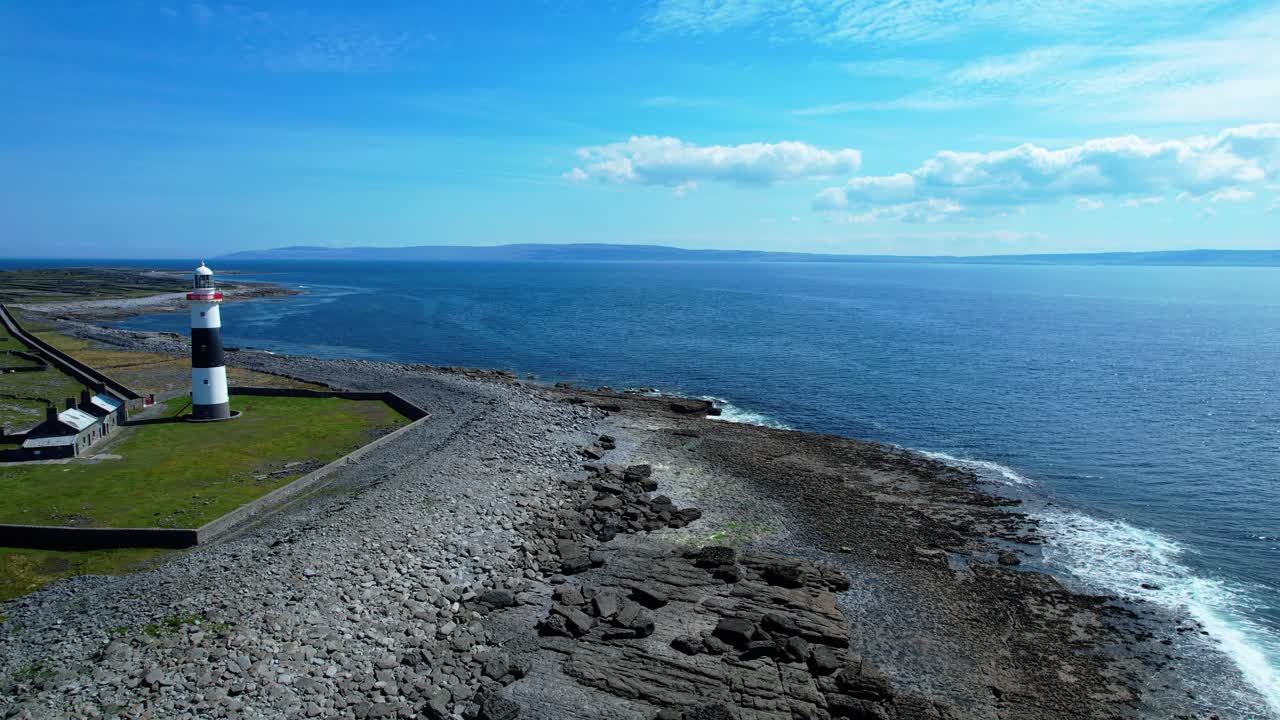 lighthouse and vast war Inisheer aran Islands Galway Bay Ireland