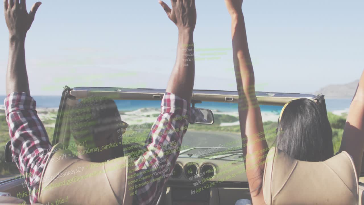 Passenger turning and gesturing, driver reaching dash, both raising arms cheering road trip coast