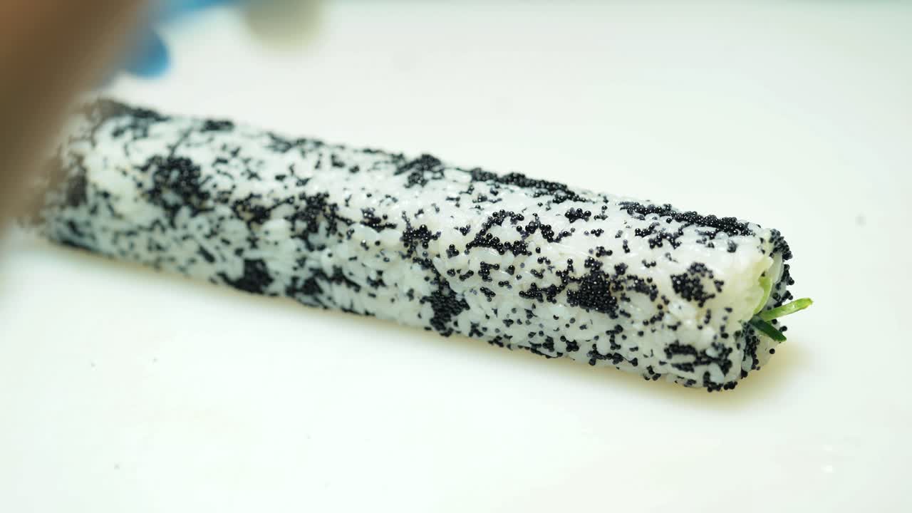 Preparing and cutting traditional sushi