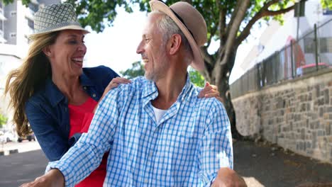 Portrait-of-mature-couple-is-smiling-and-is-on-the-same-bike