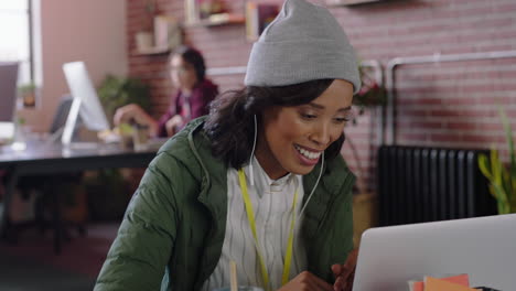 beautiful african american business woman using laptop computer video chat conversation discussing startup company project enjoying conference call online communication in trendy office workplace
