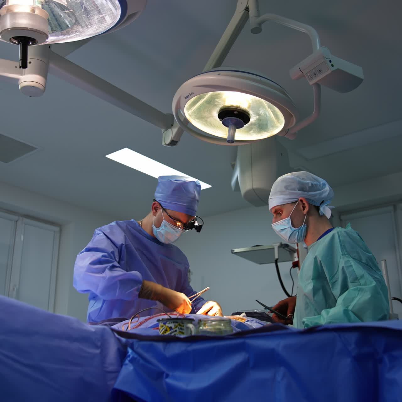 Emergency surgical patient operating. Surgery specialists working in team