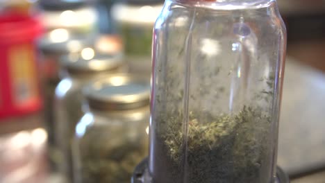 production of medical cannabis - processed and placed in jars - medium shot