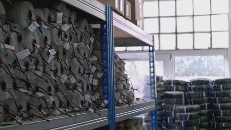 organized electrical components on shelves in a warehouse