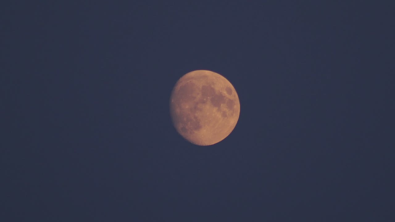 Red Moon during blue hour dusk. UK Hertfordshire
