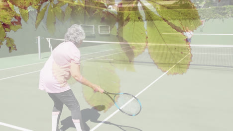 animation of glowing light over happy senior couple playing tennis