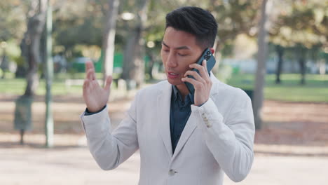 phone call, park and serious asian business man