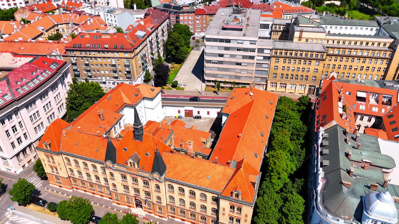 Old building with orange roof and inner closed courtyard. Drone footage above the historical part of Bratislava, Slovakia
