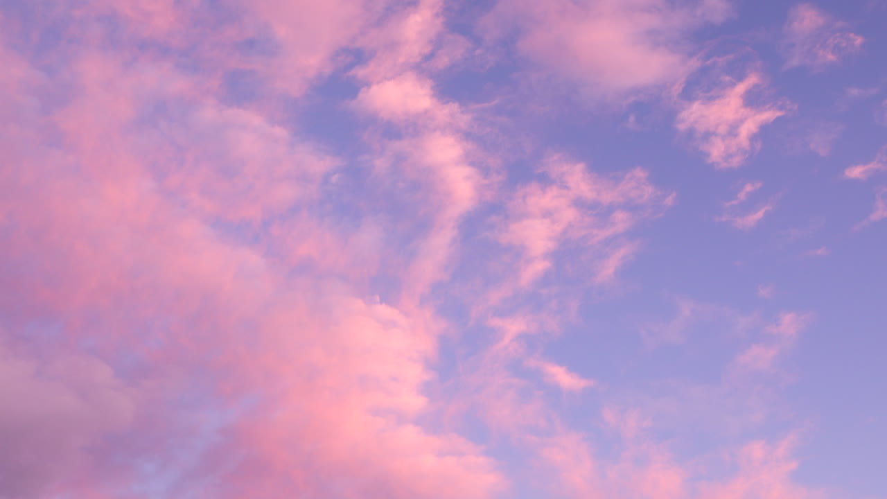 sunset with fluffy clouds of cotton candy