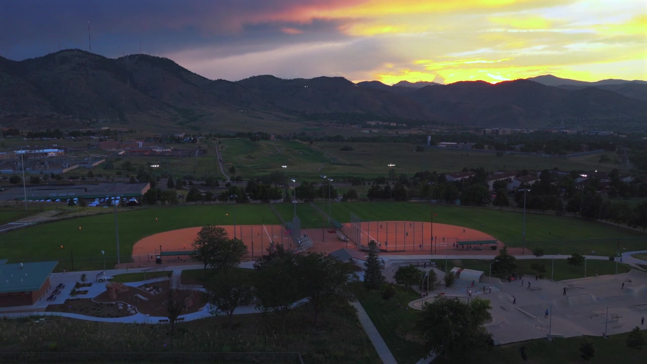Ulysses Sports Complex Field under lights Skatepark summer sunset City of Golden aerial drone Colorado Rocky Mountains Front Range foothills Clear Creek Canyon South Table Mountain backwards upwards