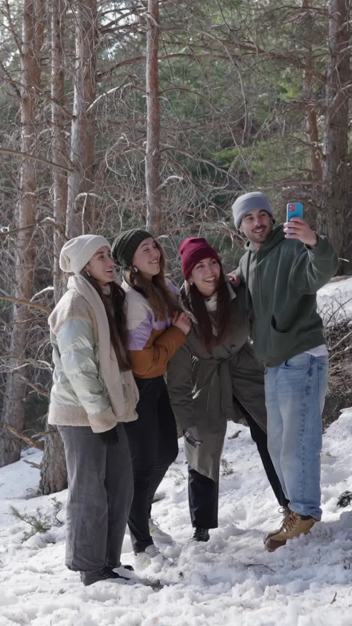 Group Selfie in Snowy Forest