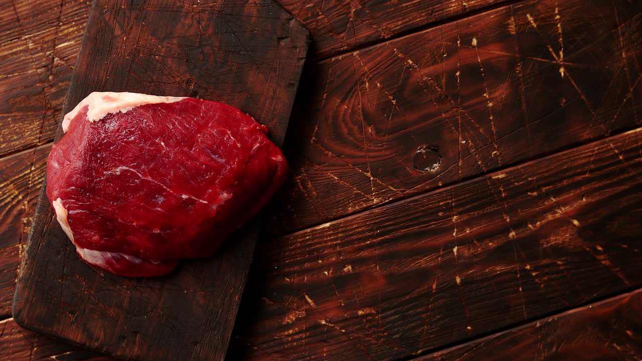 Raw meat on chopping board