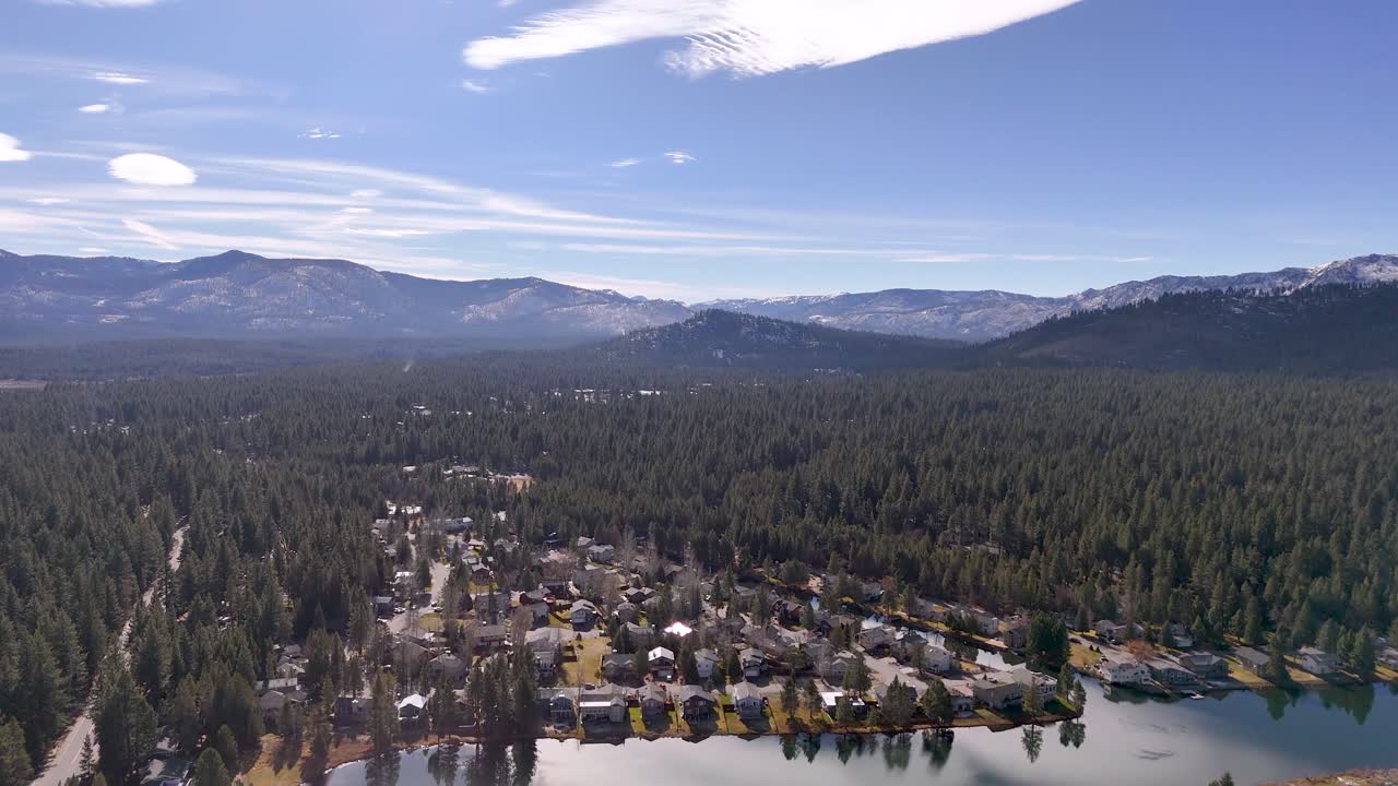 Aerial view of Lake Valley and Meyers with pine forest and highway leading to Lake Tahoe