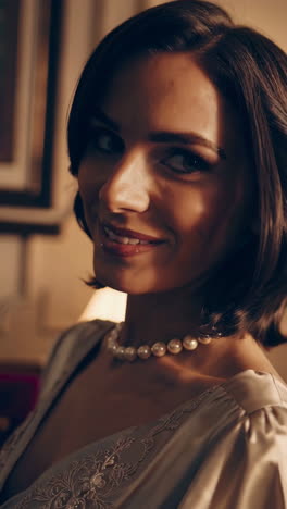 Elegant Woman Smiling with Pearl Necklace