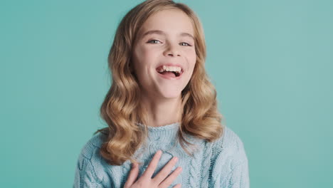 teenage caucasian girl laughing at the camera.