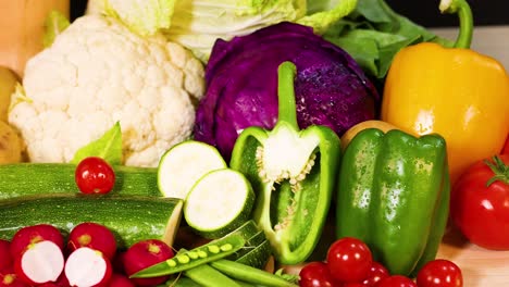 assorted vegetables arranged on a black background