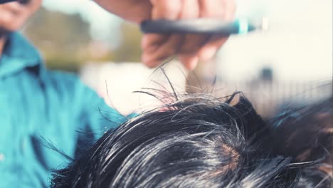 bangladeshi barber cutting hair of nepali man