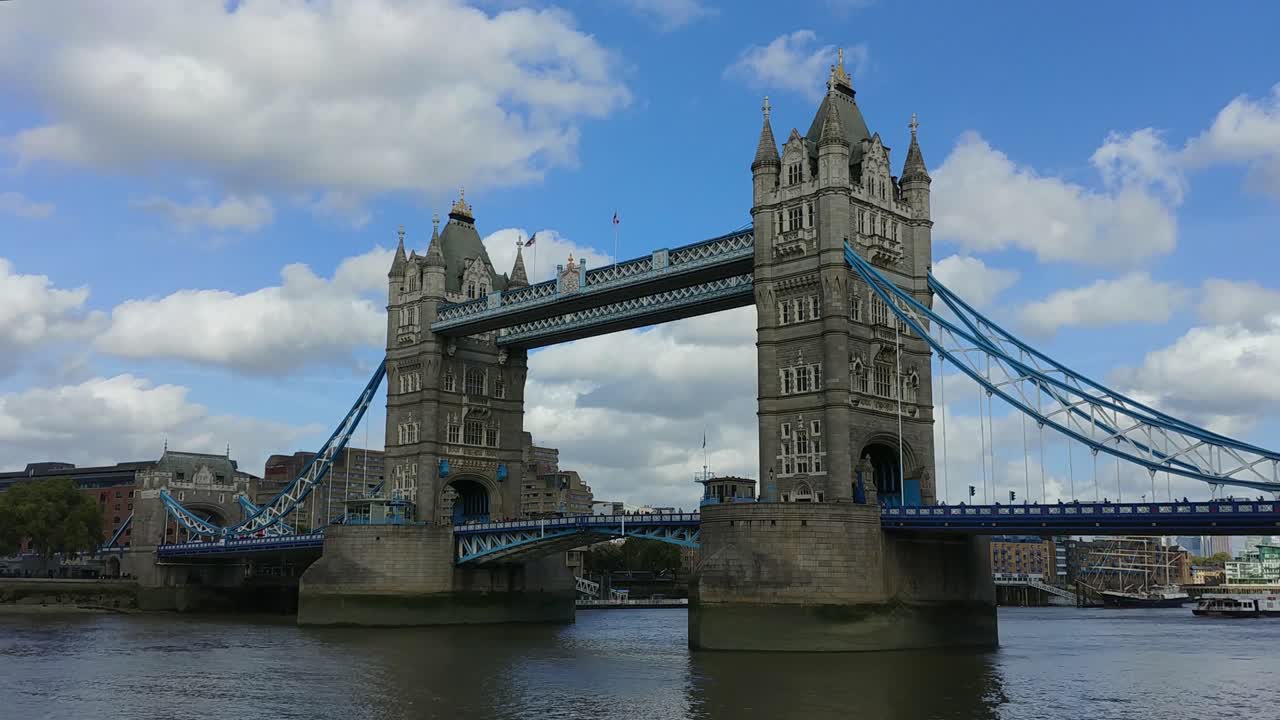Experience a vibrant hyperlapse of London's iconic Tower Bridge. Captured in daylight, this footage highlights the architectural grandeur and dynamic movement across the Thames