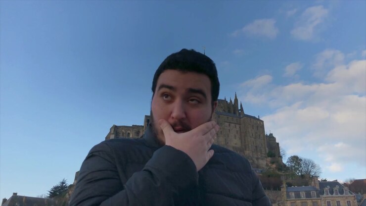 Young man is emotional after visiting religious icon Mont Saint-Michel