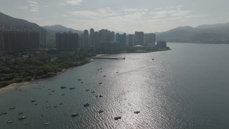 drone shot of hundreds tourism boat on the water in the city in hong kong, china