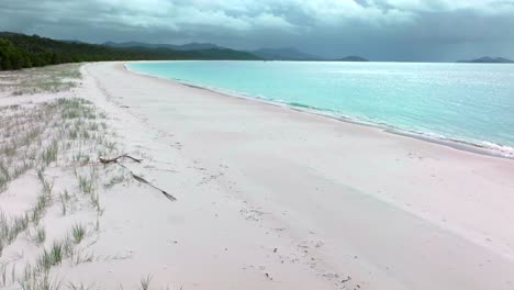 Whitehaven-Beach-aerial-drone-Whitsundays-Island-Australia-cloudy-shade-rain-sunny-sun-stunning-white-sand-outer-Great-Barrier-Reef-clear-blue-aqua-ocean-Hill-Inlet-Lookout-tourist-boat-forward-pan-up