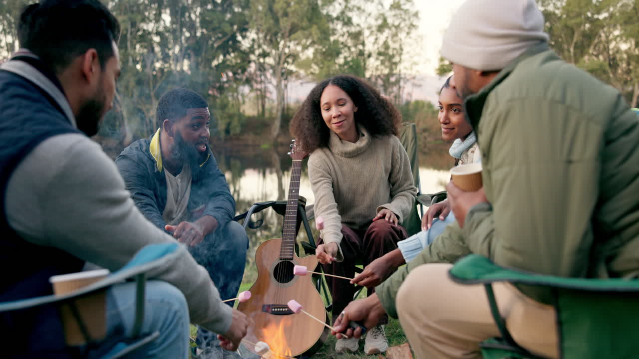 Camping, fire and friends with marshmallow