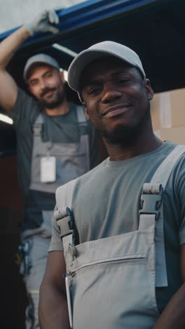 two movers smiling after a job