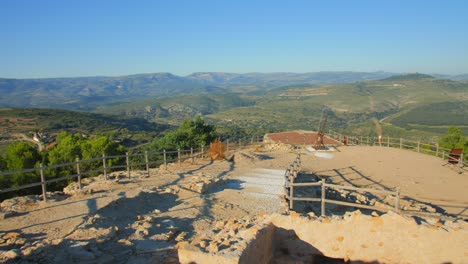 View-of-remains-of-a-medieval-castle-in-Culla,-Spain-with-a-beautiful-overview-of-the-countryside-on-a-bright-sunny-morning