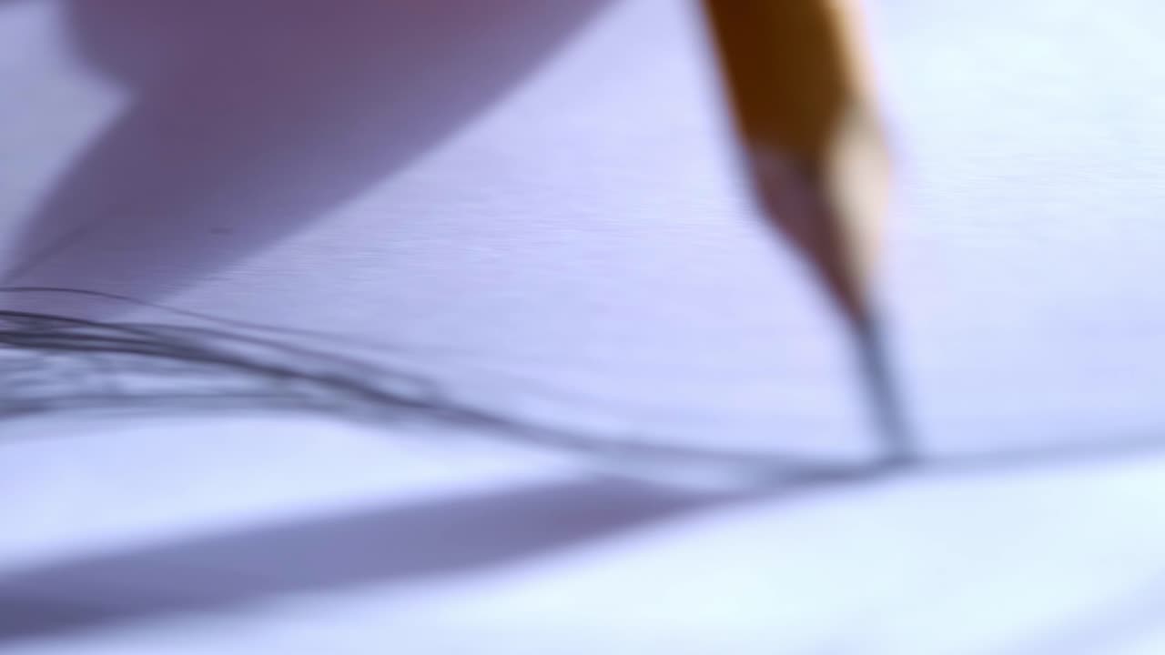 Captivating Close-up of a Pencil Creating Intricate Sketches on Paper, Showcasing the Artistry and Detail Behind the Craft of Drawing and Illustration