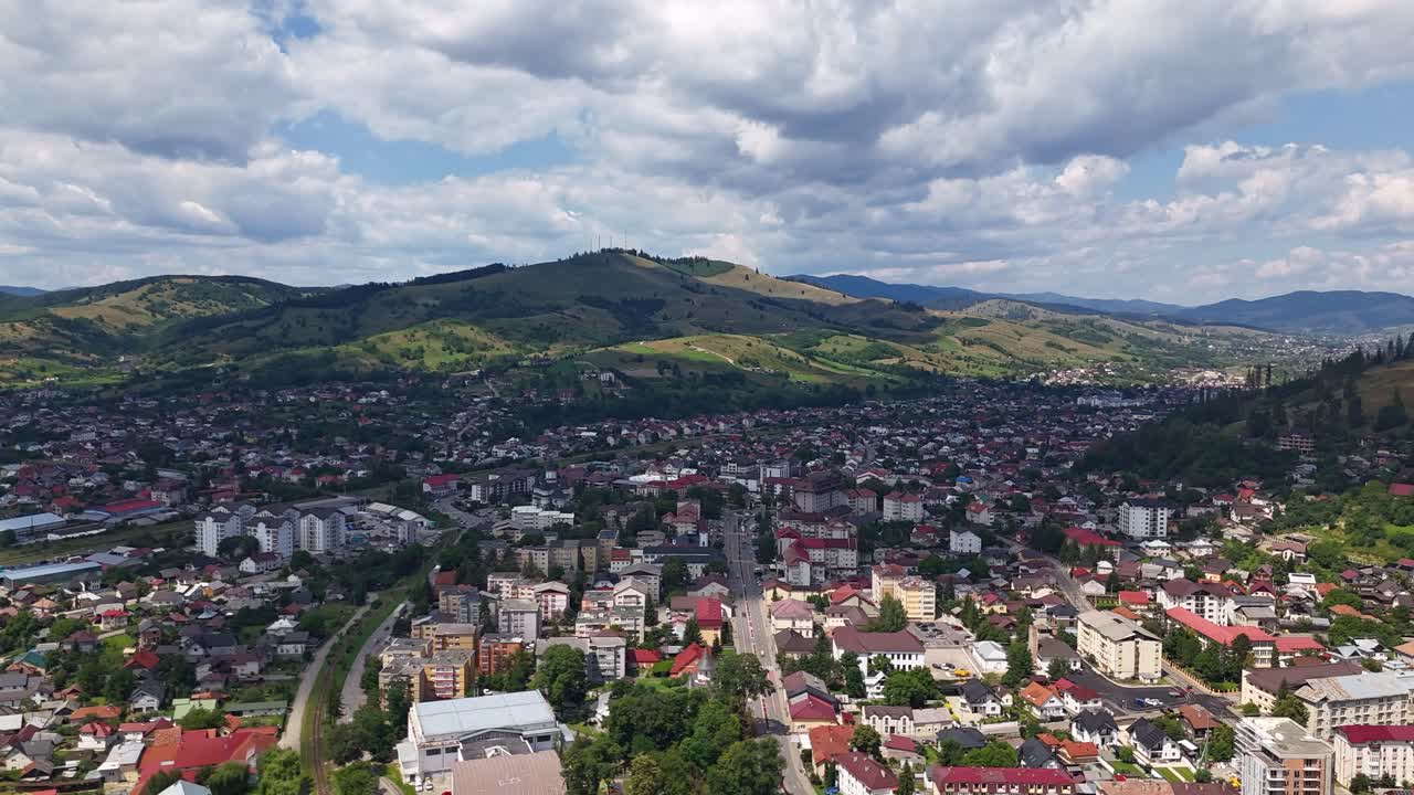 Drone hyperlapse of Gura Humorului, Romania, showcasing a the city on a sunny day