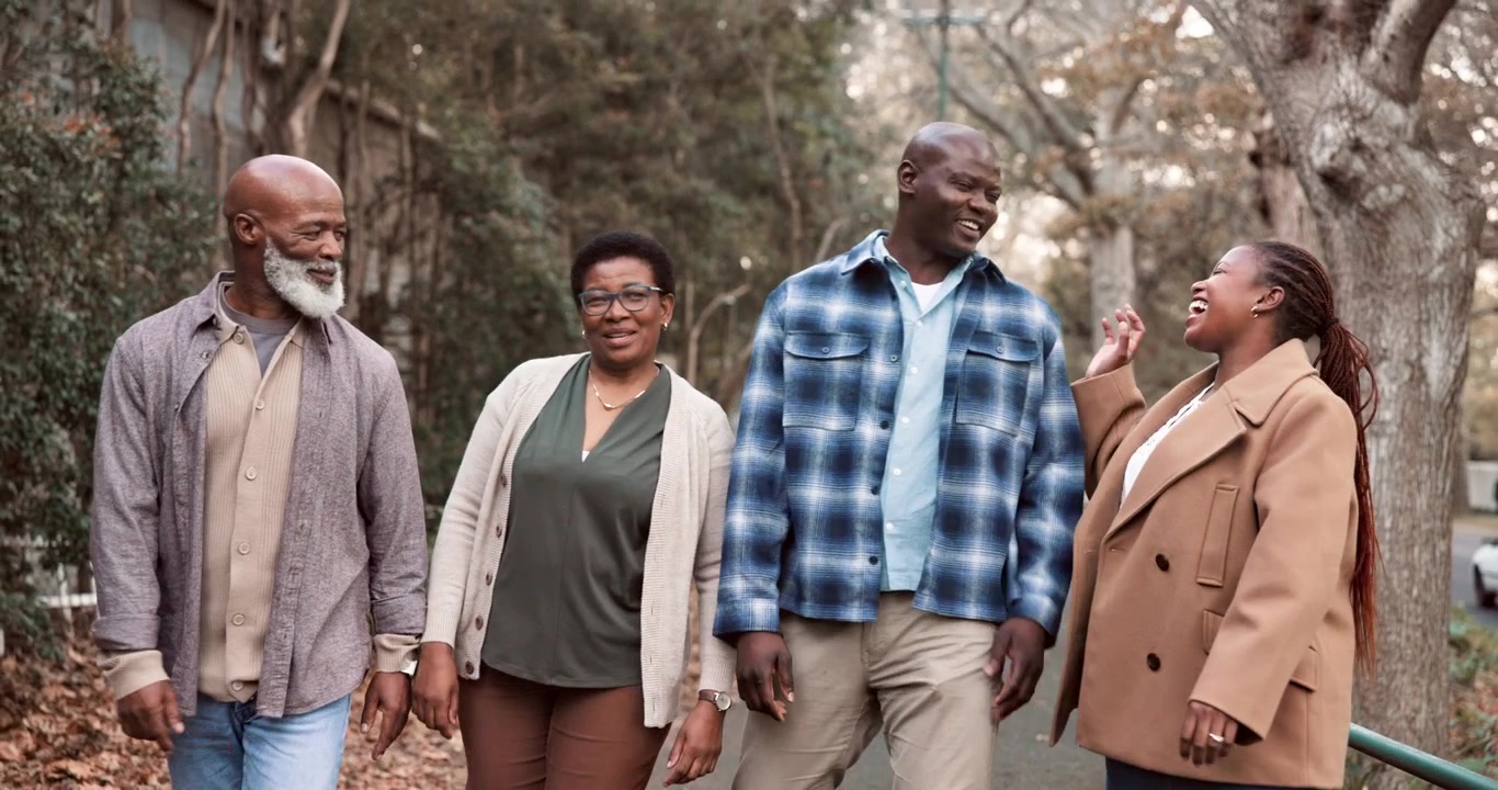 Group of Mature Friends Walking and Talking Together Outdoors
