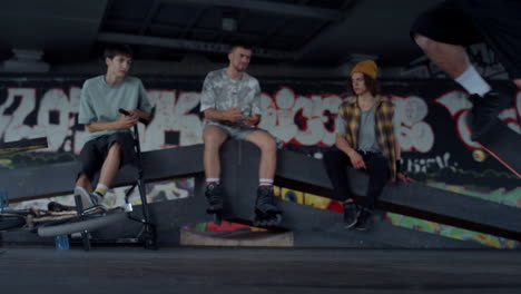 millennial boy performing skateboard tricks outdoors. man jumping on skate.