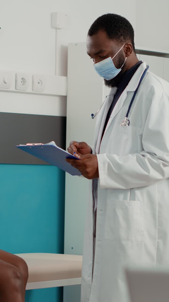 Pregnant Woman Consulting with Doctor at Clinic