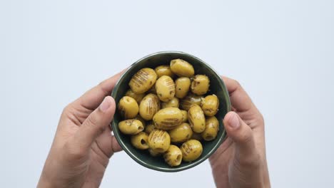 Women-holding-a-bowl-of-turkish-grilled-olives