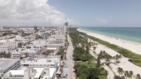 Cloud-storm-approaches-Miami-Florida,-aerial-flight-over-South-Beach